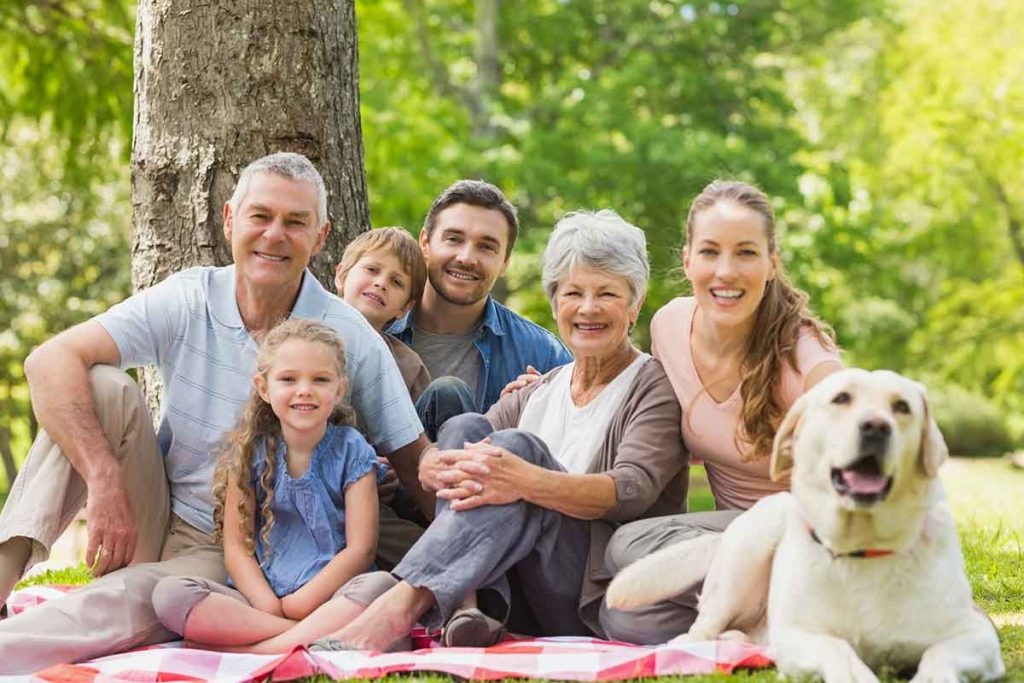 Family and dog enjoying the outdoors together
